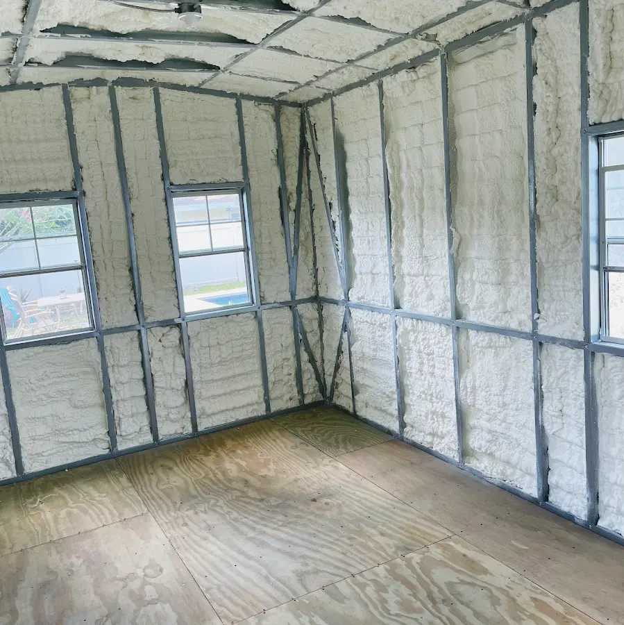 Closed-cell spray foam insulation applied to wall cavities in a residential project in Urbana